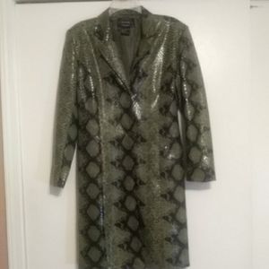 Light coat looks like leather, has a shine too it.